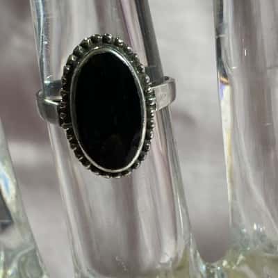 SILVER RING WITH A BLACK STONE INSERT