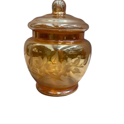 Vintage marigold iridescent carnival glass lidded jar with etched floral pattern 
