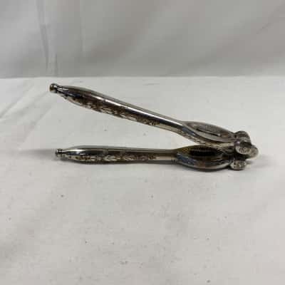 Vintage silver plated reversible nutcracker 