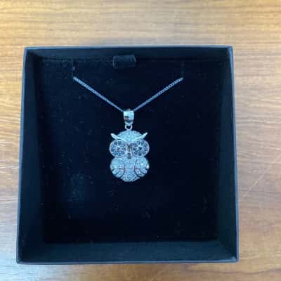 Silver toned owl necklace with clear/silver coloured stones