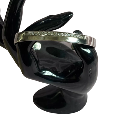 925 MARKED BANGLE WITH ROW OF CLEAR STONES  