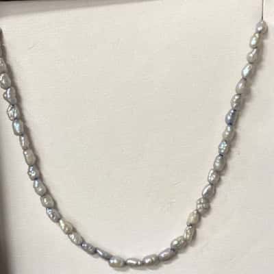 Sterling silver and baroque pearl strand 