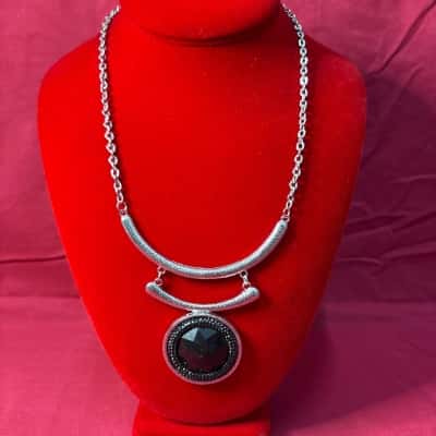  Women's Silver Tone  Necklace featuring A large Circular Black Pendant