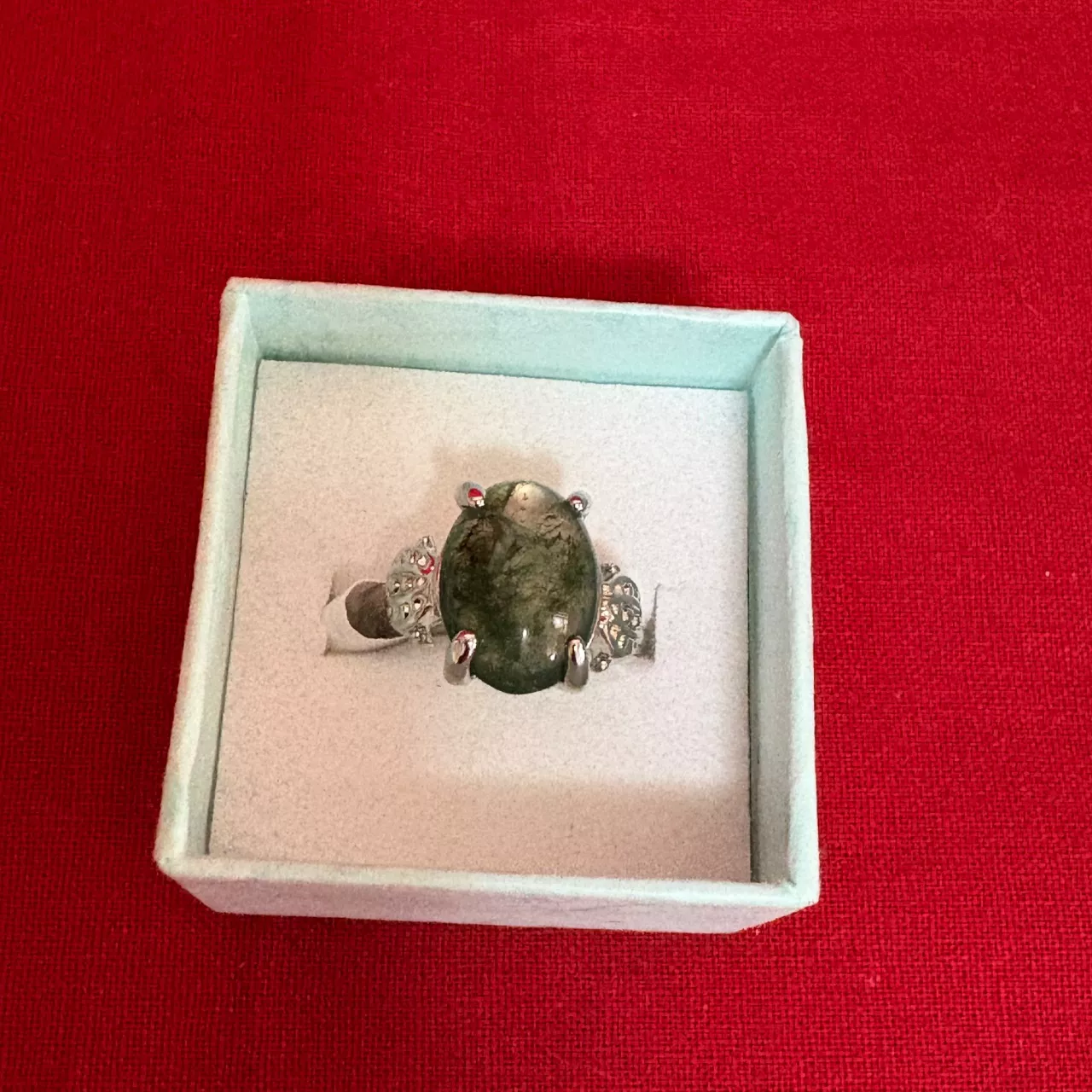 Women's Silver Tone Ring featuring a Polished Oval Shape Greenish Stone