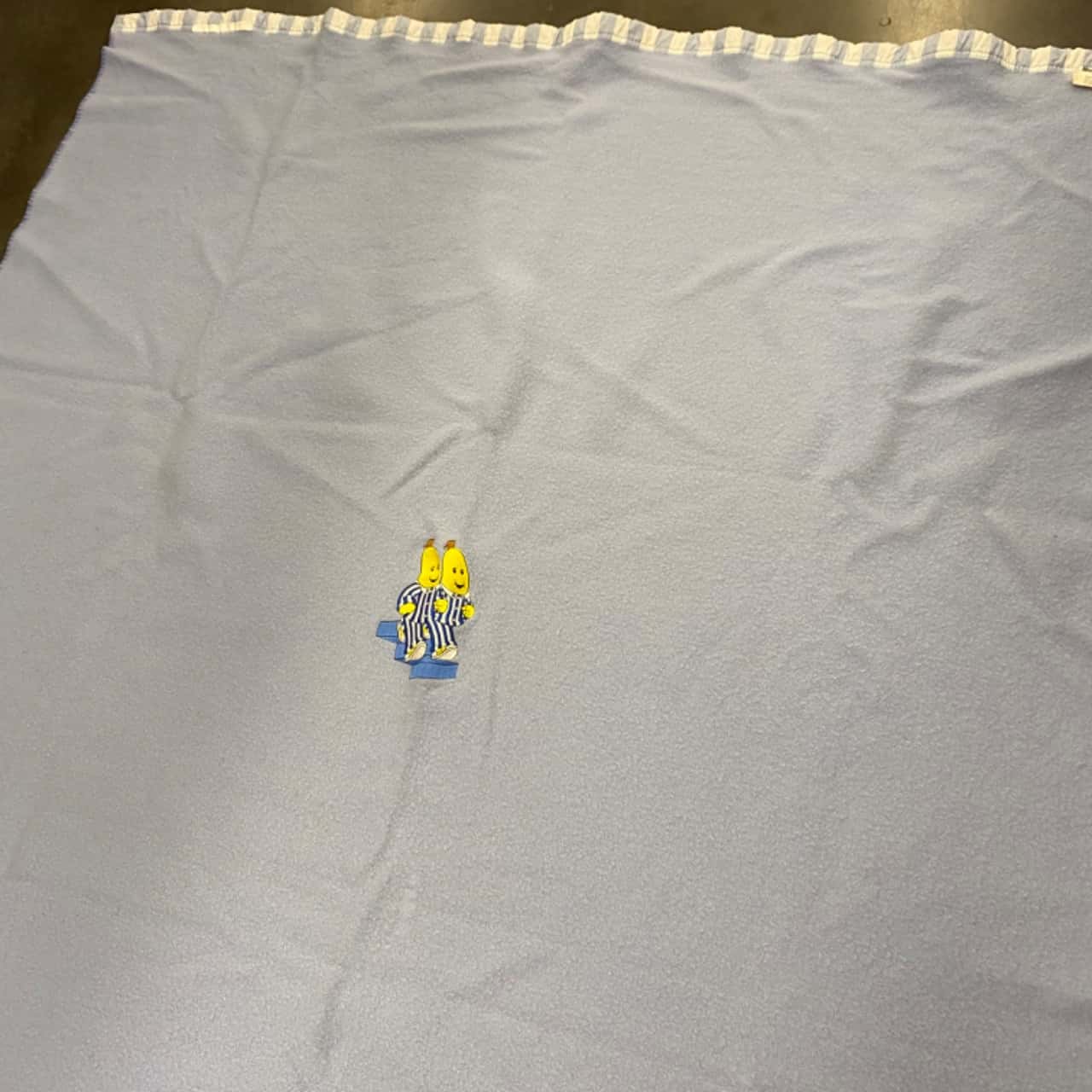 Onkaparinga. Light blue wool blanket with B1 & B2 (Bananas in Pyjamas