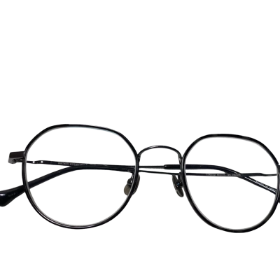   glasses in the image are round, black metal frames, appearing to be a vintage-inspired or classic style. They are shown with a matching WTR CITIZEN branded