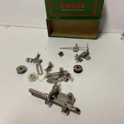 Antique singer sewing machine accessories in box