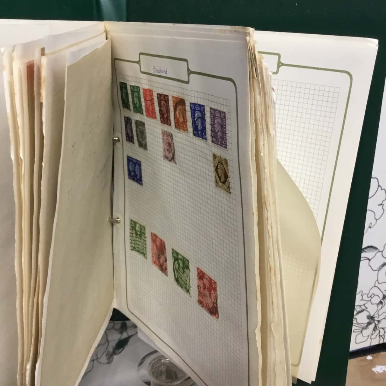 stamp collection in green binder (s)