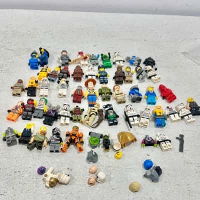 50 Lego Figurines plus a few extra pieces