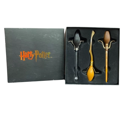 Harry Potter Broomstick Bookmark Set featuring die-cast metal miniatures of the Nimbus 2000, Nimbus 2001, and the Firebolt.
