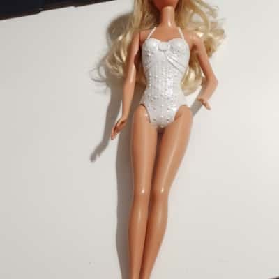 Barbie Doll attached white costume to Body blonde hair no.149 with 2 Mermaid Tails. Missing Red Skirt (b12)