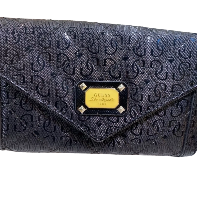 GUESS "Laurel" small crossbody wallet or envelope clutch featuring the brand's iconic logo pattern and a gold-tone emblem