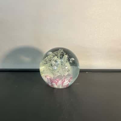 Blown glass paper weight with glow powered inside