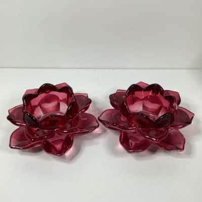 Two red glass flower candle holders