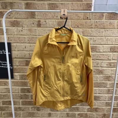 Kathmandu Womens yellow pack & go jacket Size 8 