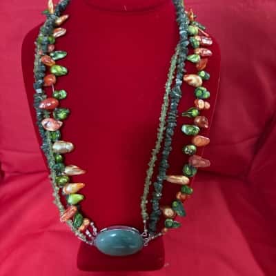  Women's Multi Strand Beaded Necklace featuring a Large Green Stone Center Piece 