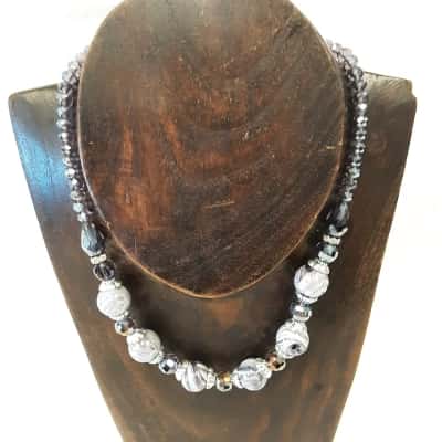 Purple and grey marble bed necklace featuring swirl pattern featured beads and small crystal spaces