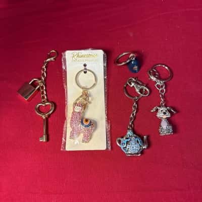  Women' Five Keyrings 1. Rhinestone Lama, 2. Gold Tone Key & Lock, 3. Rhinestone Filigree Teapot, 4. Sparkling Crystal Rhinestones Dalmatian Puppy dog, 5. Bobby's Hat 