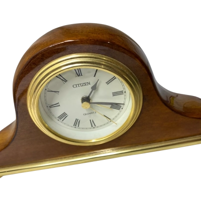 a vintage-style Citizen Quartz mantel clock featuring a wooden construction and a brass-colored bezel