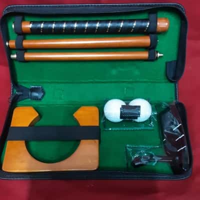 Handy travel golf putter set includes collapsible putter balls  & cup housed in a carry case