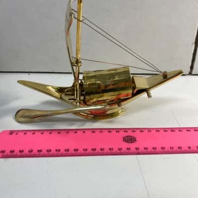 Vintage traditional sailboat with oar