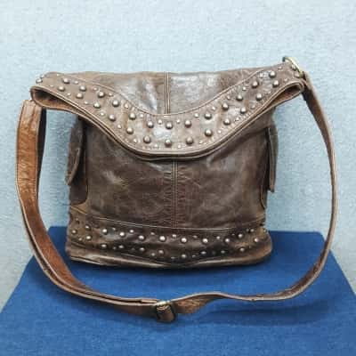 Brown distressed look larger size handbag with studded detail