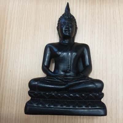  Serene and calming seated Buddha figurine captured in the traditional lotus meditation pose