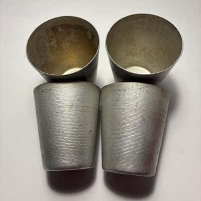 Vtg. 4 Mid Century Aluminum Tumblers with a textured exterior and a classic tapered shape