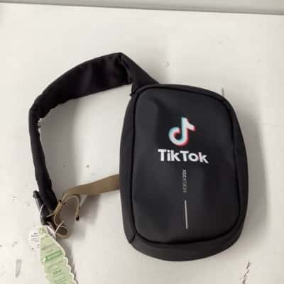  XDDESIGN anti-theft Bobby Sling with tiktok logo. USB charging port and audio jack features. backpack