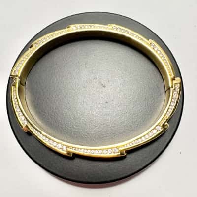 Stunning gold plated bangle with cubic zirconia stones stamped 8”
