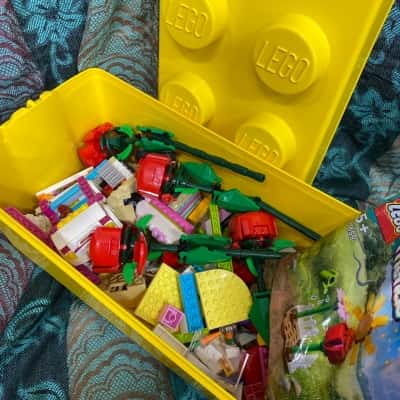 Lego. Lego friends bricks, flowers, etc. in Lego box. 