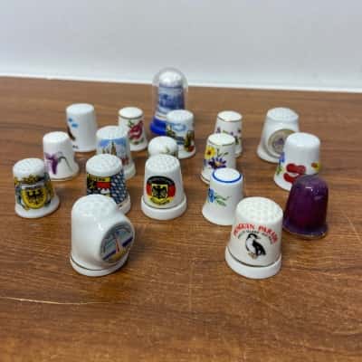 Collection of 19 decorative souvenir thimbles 