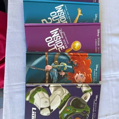 Books from the Disney Movie Collection and Disney Pixar Storybook Series.  The collection includes stories from films such as Inside Out, Inside Out 2, Brave, and Lightyear.  The books feature characters and scenes from the respective movies. (B24)
