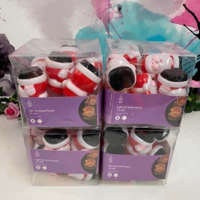 4x packs of light up santa heads 