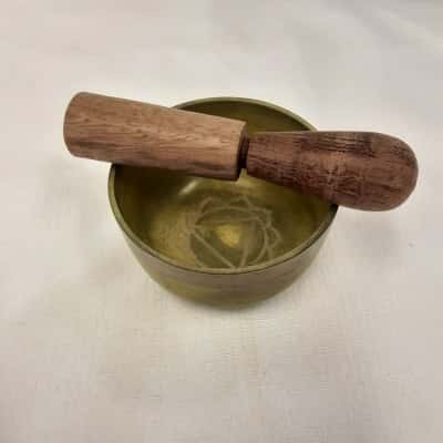 Small size green and brass tone singing bowl with wooden Striker