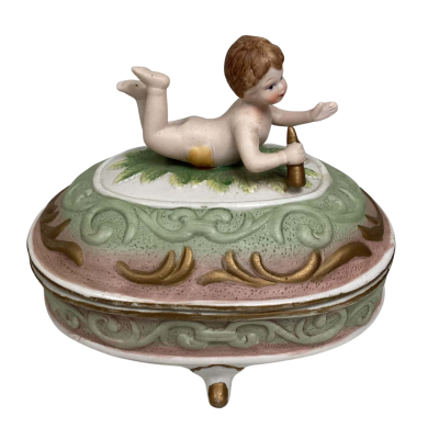 Vintage bisque porcelain trinket box with cherub on lid