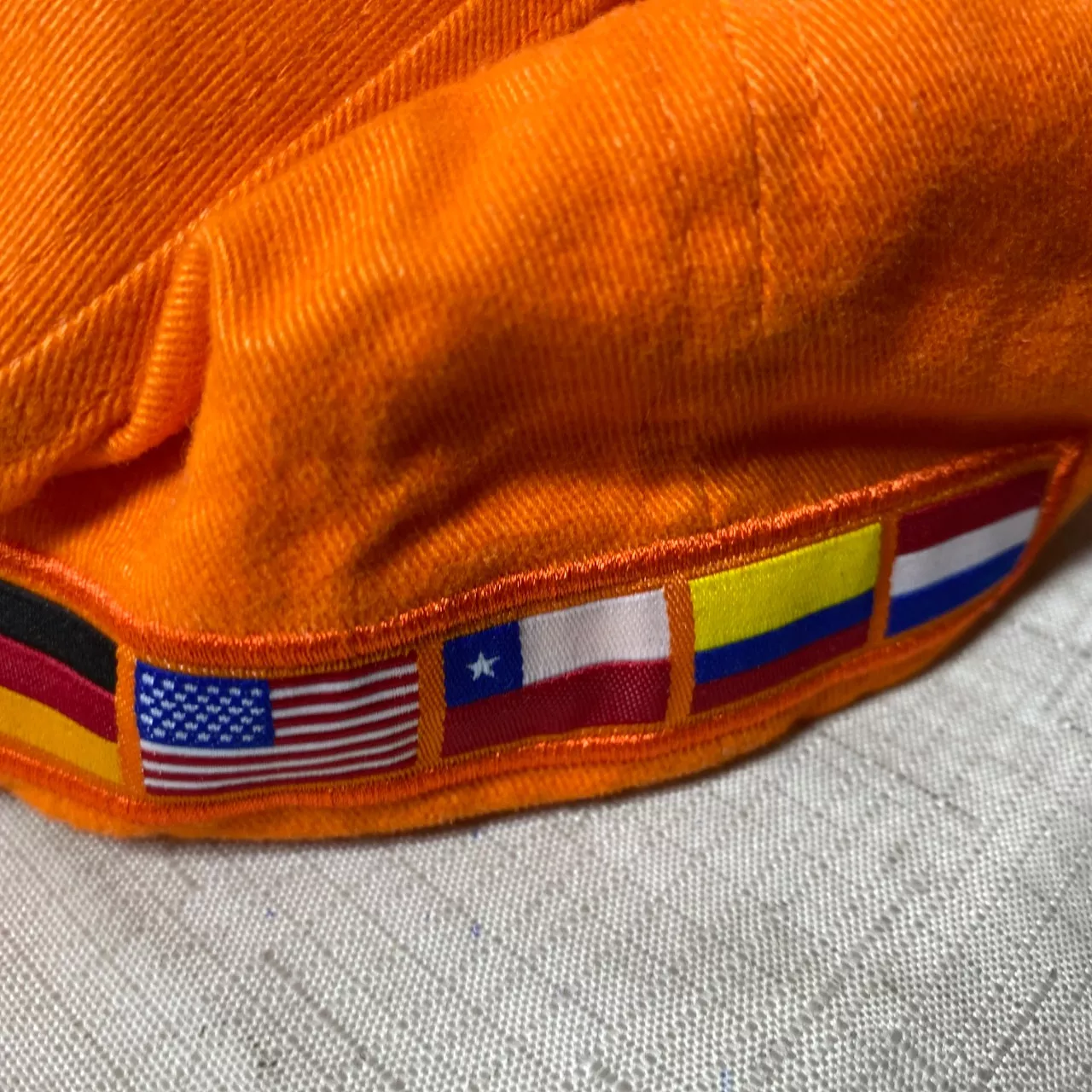Gaf Hat orange baseball cap featuring an embroidered logo for the company