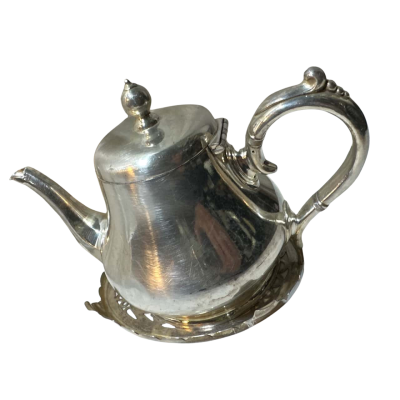 silver-plated teapot, likely part of a larger tea or coffee set
