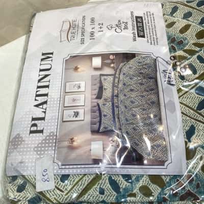 TRUE HOME PLATINUM", likely containing a sheet and two pillowcases