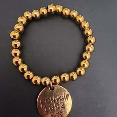 Cat Hammill Gold Alloy elastic bracelet "pouvoir 1952"
