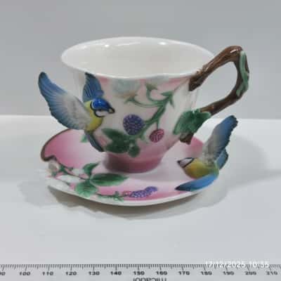 Franz Porcelain Teacup and Saucer Set PreOwned Bluebird, Berries, Bark Handle