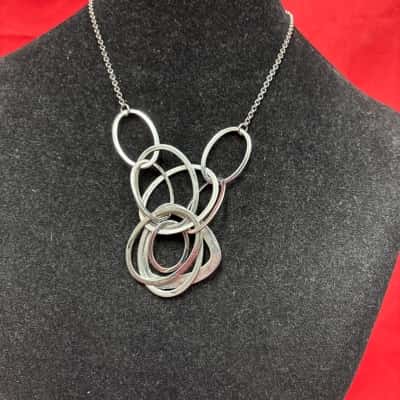  Womens Silver Tone Statement Necklace featuring a multi layered cluster of hoops 