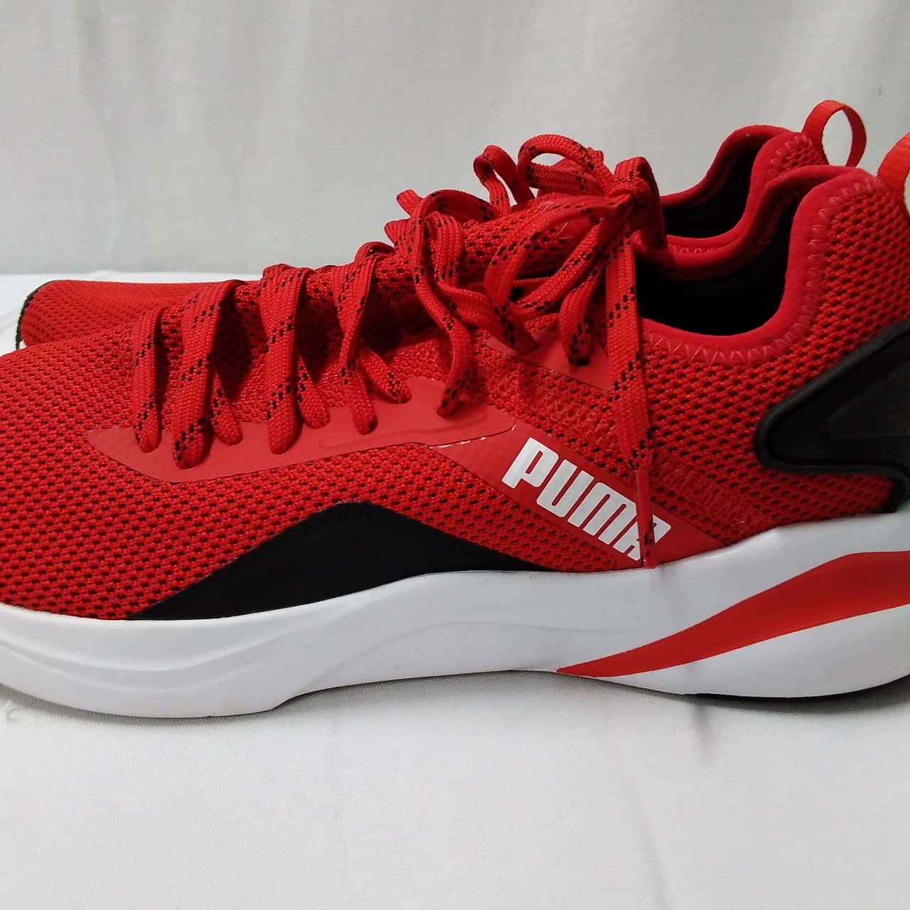 puma black red shoes
