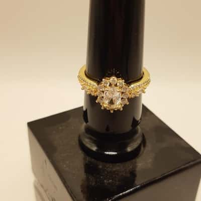  Women's yellow gold plated ring oval cut stone with dainty halo of smaller gems 