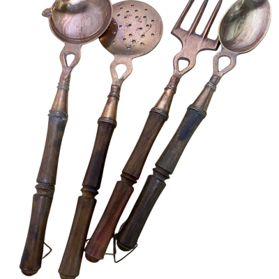 Vintage brass and wood serving utensils. 