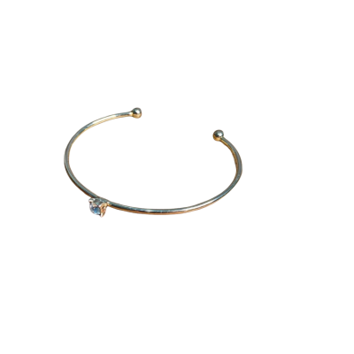 Gold toned Open Cuff with a single round Clear Stone 