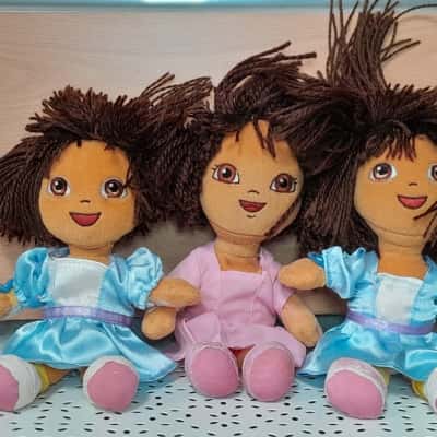 Assorted doll clothing and dolls