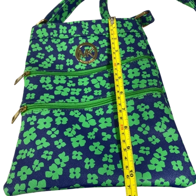 blue crossbody bag with a green floral or clover pattern and a prominent gold Michael Kors logo medallion on the front. 28x21 cm