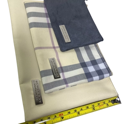  Womens set of three nested Burberry-branded pouches or cosmetic bags featuring a classic check pattern and a small gray suede-like pouch with a wrist strap.