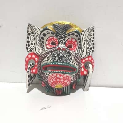 Hand carved and painted wooden mask of Hanuman.